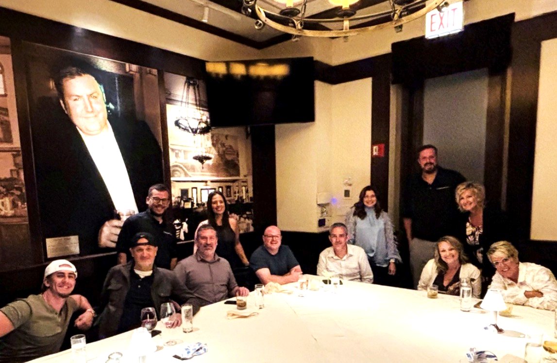 The Swipe Tech team together at a company dinner in metro Detroit